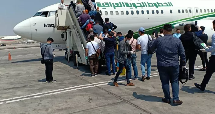 العراق يعيد مواطنيه العالقين في مصر