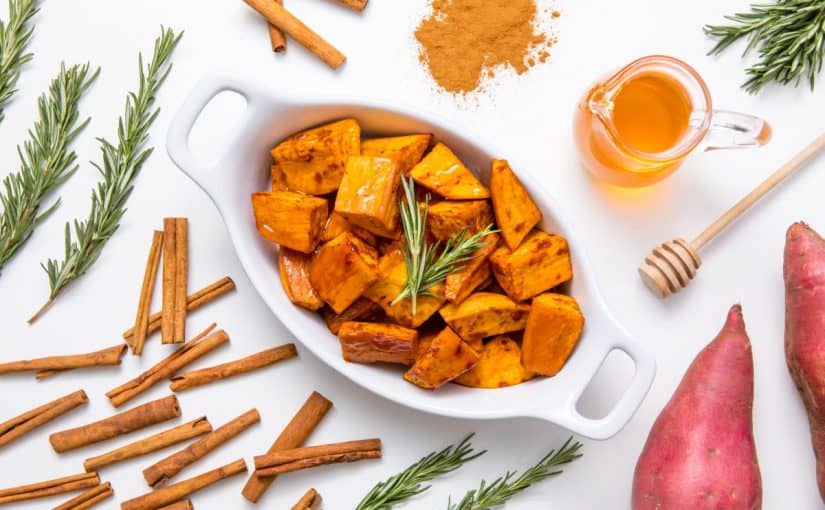 5d4b5901-honey-cinnamon-roasted-sweet-potatoes-plated-sweet-potatoes-on-a-white-table-surrounded-by-cinnamon-sweet-potatoes-honey-and-rosemary-1200x800-825x510-2 وصفات القرفه للتخسيس