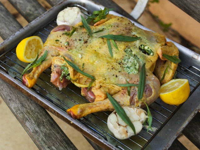 Lemon chicken prepared for roasting on a roasting tray