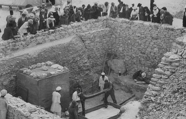 Tutankhamun's tomb, pictured here while treasures are removed after its discovery in 1922, will be searched with radar scans for any hidden passages which may exist