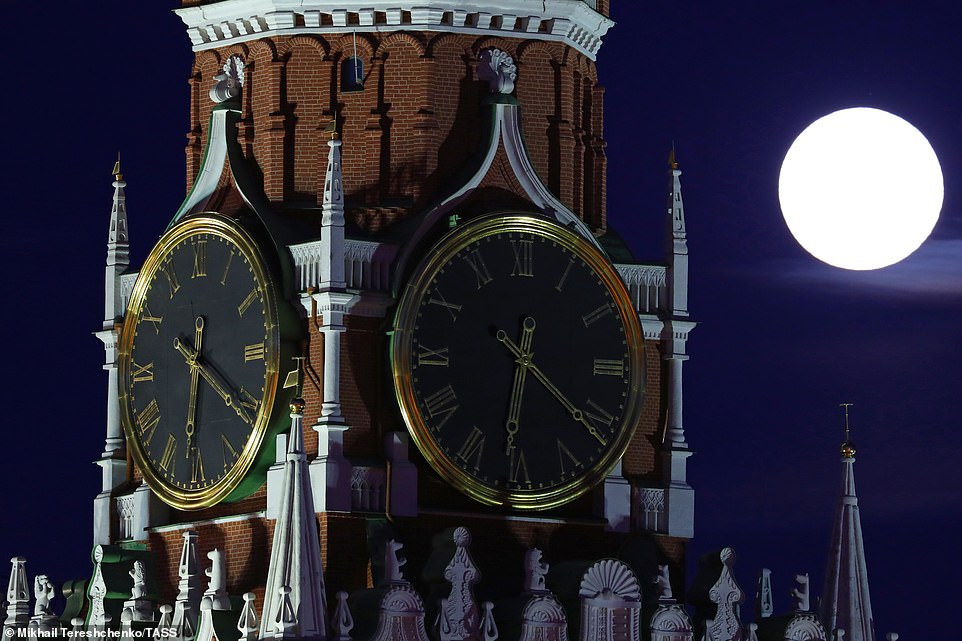 10011274-6721945-image-a-50_1550600584030 The full Moon shining over the Moscow Kremlin's Spasskaya Tower. The best time to view the larger than normal moon on last night was shortly after moonriseÂ