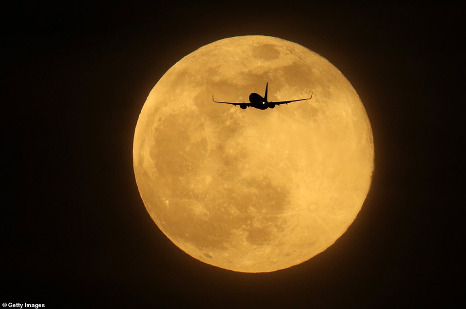 10011970-6724033-a_plane_flies_in_the_sky_in_front_of_the_largest_supermoon_of_20-a-3_1550649996340 A plane flies in the sky in front of the largest Supermoon of 2019 in London, England, on Tuesday. The current supermoon, sometimes known as the Super Snow Moon