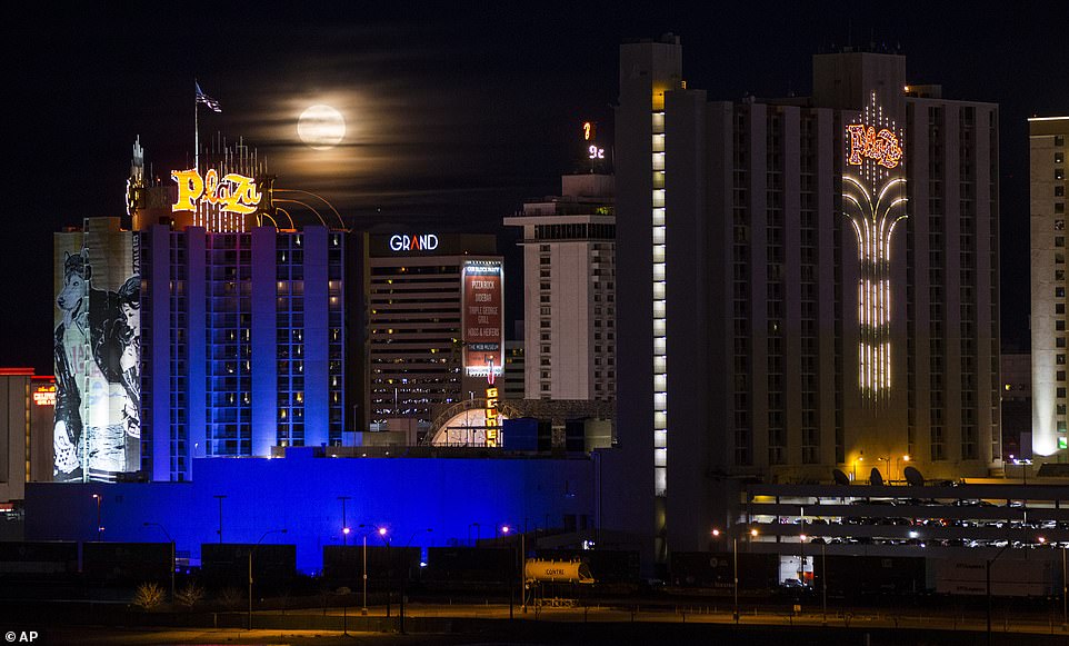 10032262-6723727-image-a-7_1550642572610 A supermoon is a phenomena that occurs when the moon's orbit is closest to Earth making it appear full, bright, and larger than life. A super snow moon rises over the Plaza Hotel and Casino in downtown Las Vegas on February 19