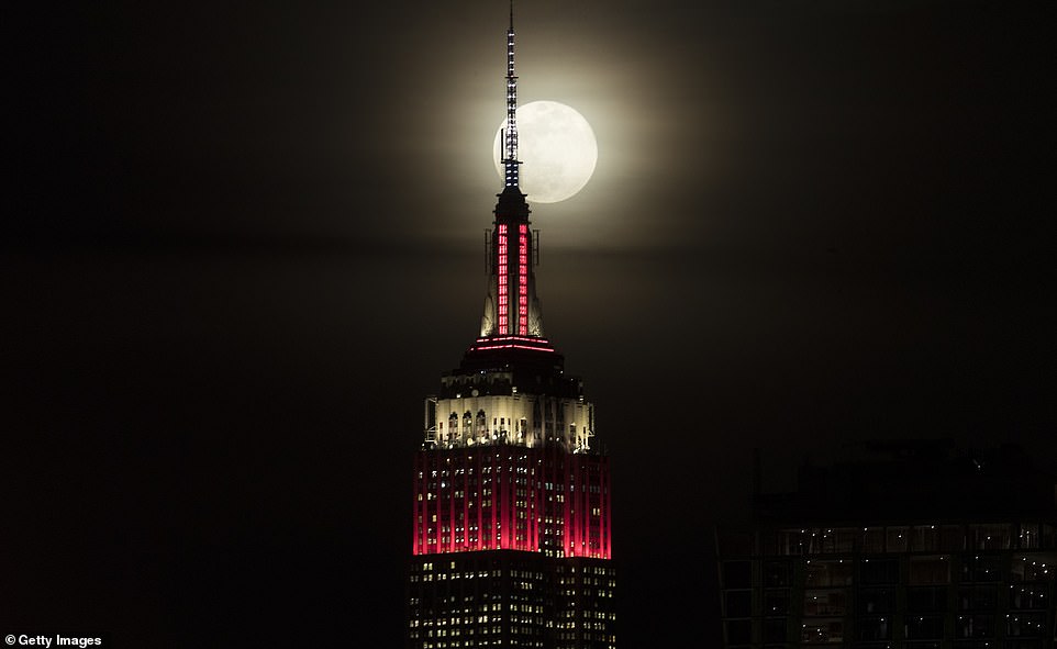 10032270-6723727-image-a-1_1550642507445 Stargazers across the United States were treated to a stunning showing of the 'super snow moon' on Tuesday night, as the two-day event resurfaced on the east coast at 5.33pm in Rhode Island. The Empire State building is shown in the foreground as a super moon rises in New York on February 19