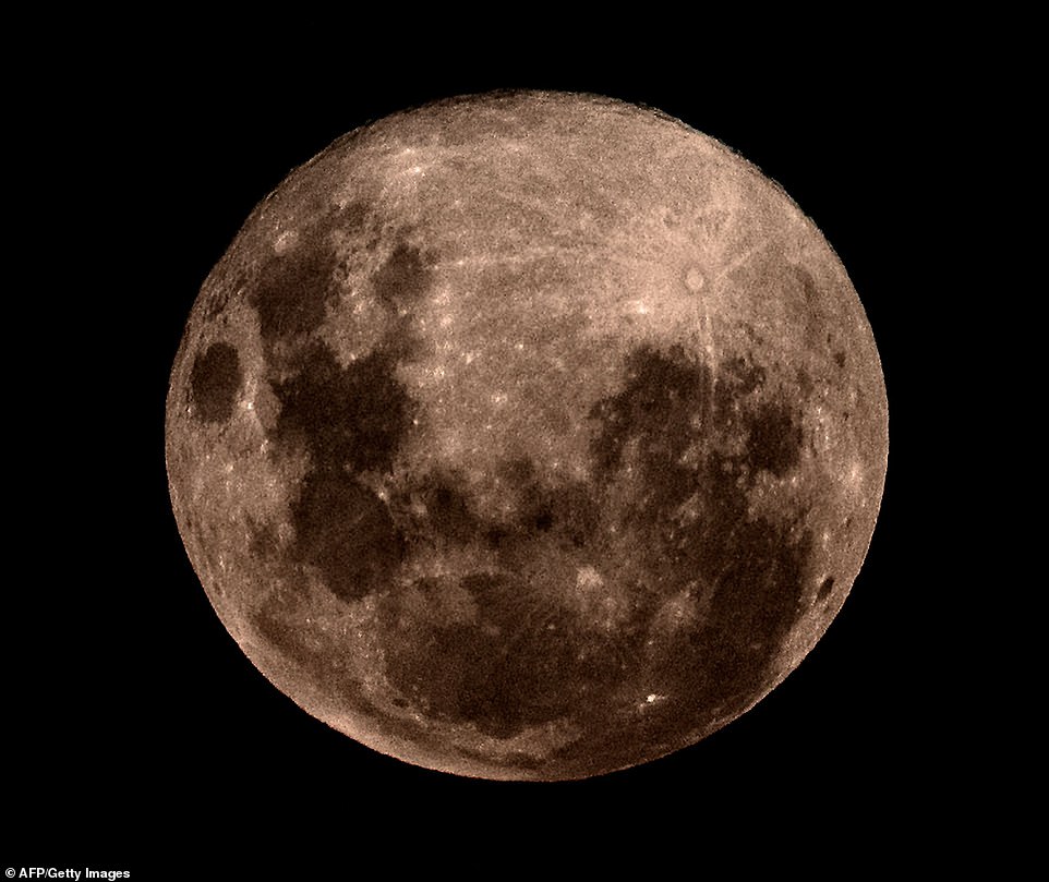 10036302-6724033-image-a-18_1550652832256 Rising over Rio de la Plata. It's the second of three supermoons to light up the skies this year, following the Super Blood Wolf Moon that took place on January 21 and preceding yet another on March 21