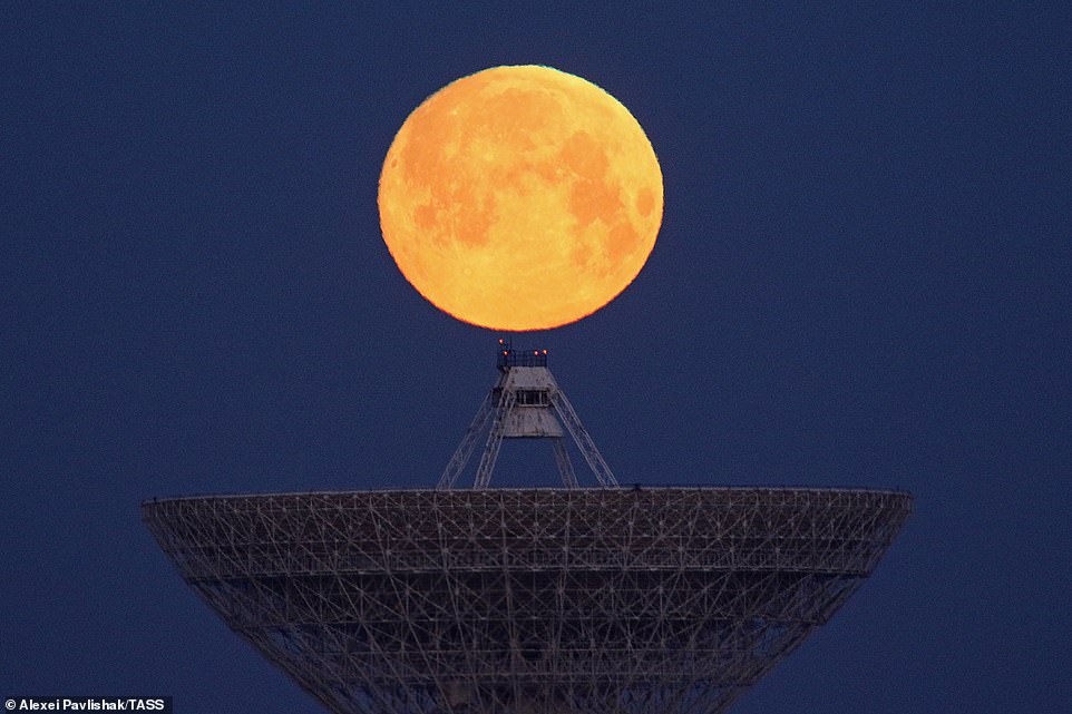 10036766-6724033-image-a-28_1550653666093 The full Moon shining over the RT-70 radio telescope near the village of Molochnoye in Saky District in Crimea, Ukraine. During the event, the moon appears up to 14 per cent larger and 30 per cent brighter than normal