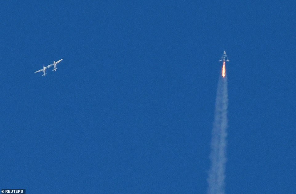The SpaceShipTwo VSS Unity passenger craft (R) is seen after separation from Virgin Galactic rocket plane, the WhiteKnightTwo carrier airplane (L)
