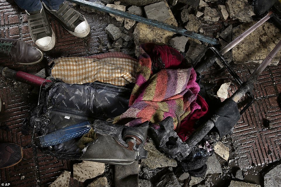 The contents of a burned-out suitcase are strewn across the platform of Ramses station after it was gutted by fire