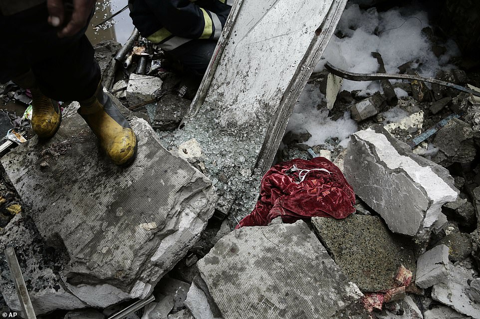 A charred piece of clothing sits among the burned-out rubble of Ramses station as fire crews pick through the devastation