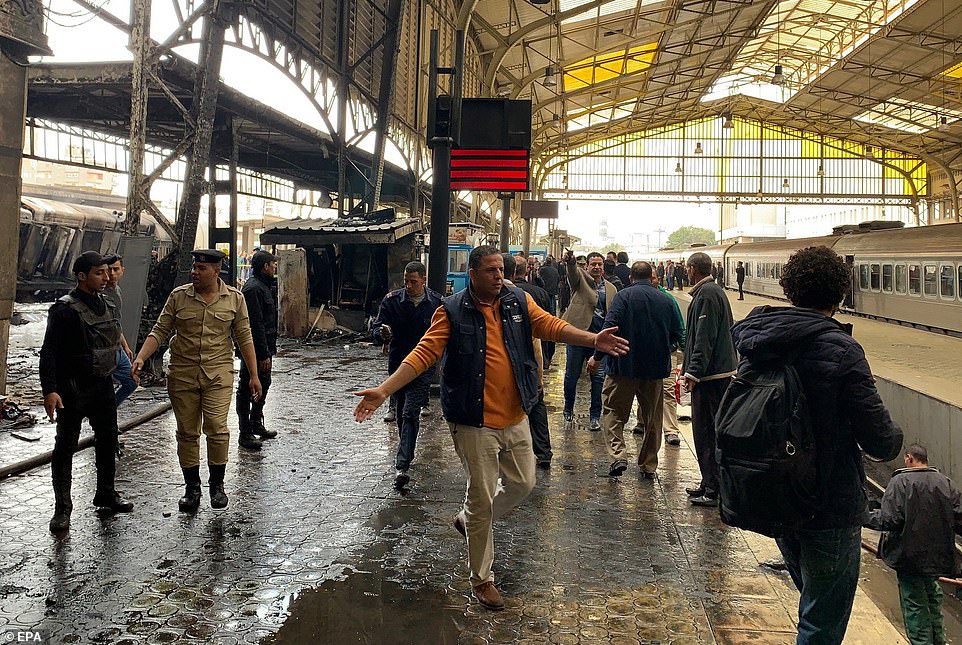 Emergency workers patrol up and down the platform and Ramses station as the cleanup operation gets underway