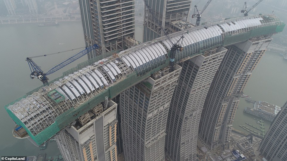 10358806-6751491-image-a-10_1551274607065 'Horizontal skyscraper': The rooftop corridor is laid across the tops of four 60-storey buildings at 820 feet above the ground