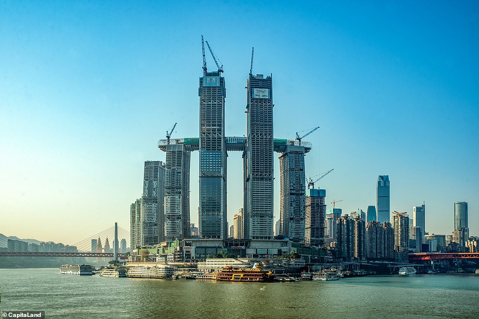 10358810-6751491-image-a-9_1551274604484 New landmark: A mega-structure comprising eight skyscrapers and an impressive sky bridge is near completion in China