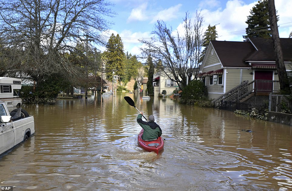 Residents returned to scenes of devastation and pictures from the scene show people kayaking down roads 