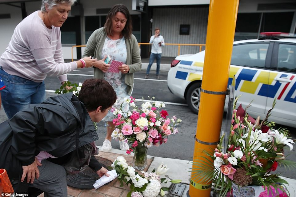 11051594-6812527-image-a-8_1552681239408 Local residents leave floral tributes at Deans Avenue near the Al Noor Mosque on March 16, 2019 in Christchurch, New Zealand. At least 49 people are confirmed dead