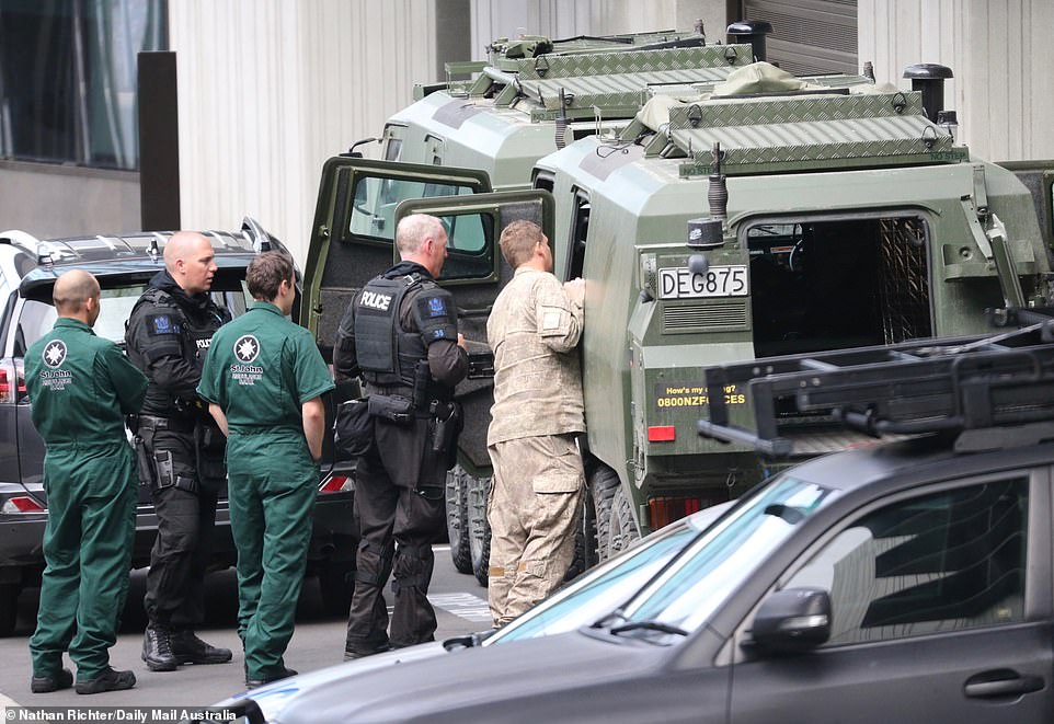 11059954-6815593-image-m-47_1552699607541 With hundreds of people gathering at Christchurch District Court, a heavy police presence was required - including armoured vehicles