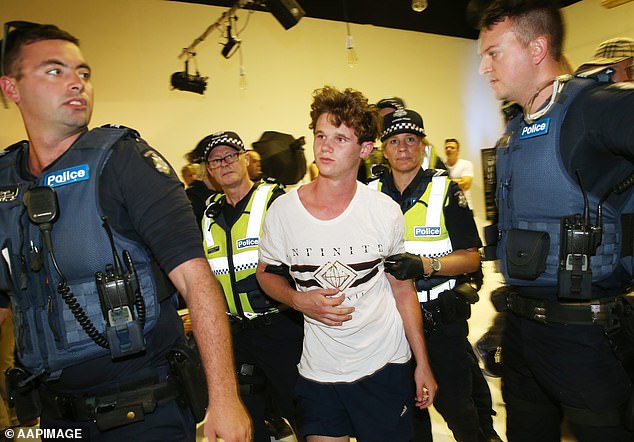 11064492-6816145-the_young_man_was_removed_from_the_event_by_victoria_police_pict-a-16_1552718260856 The young man was removed from the event by Victoria Police (pictured)