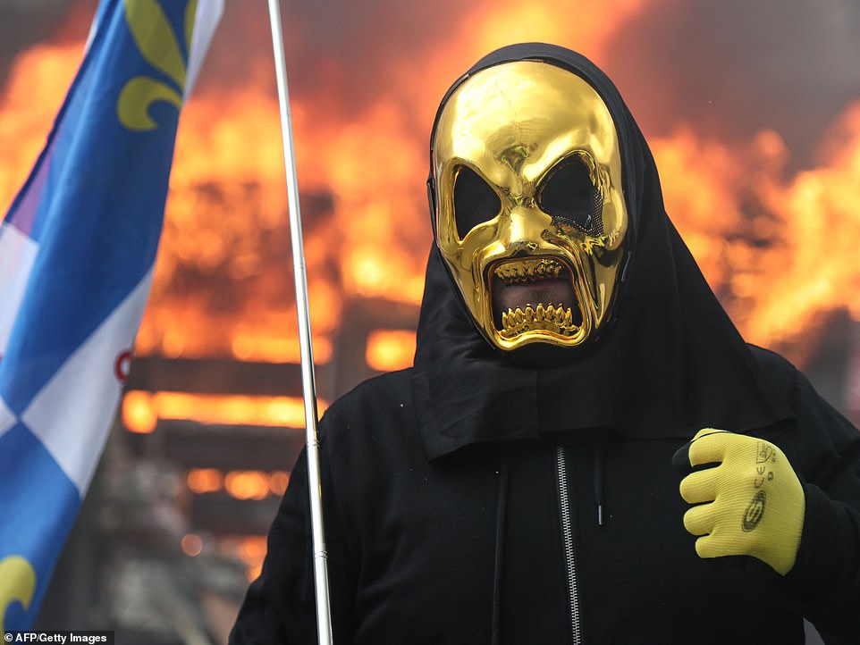 11074014-6816815-image-a-10_1552744223339 The protesters were attempting to march on the Elysee Palace, Mr Macronâs official home, but were held back by barriers and rows of police