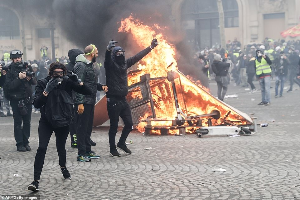 11075022-6816815-image-a-20_1552745250806 Fighting broke out on the Champs Elysee, the most famous avenue in the French capital, by 11am, when there had already been 25 arrests