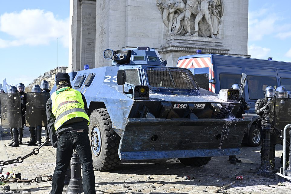 11077816-6816815-image-a-82_1552752099929 Security forces bring in armoured vehicles to guard the Champs Elysees as tensions continue to grow over the increased taxes and high cost of living