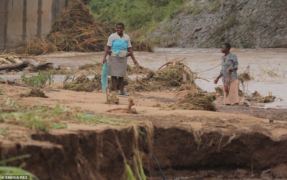 11142916-6822597-farmers_check_their_crop_after_the_area_was_hit_by_cyclone_idai_-a-14_1552931810533 Farmers check their crop after the area was hit by cyclone Idai in Chimanimani, Zimbabwe. At least 215 people are believed to have died in the three countries