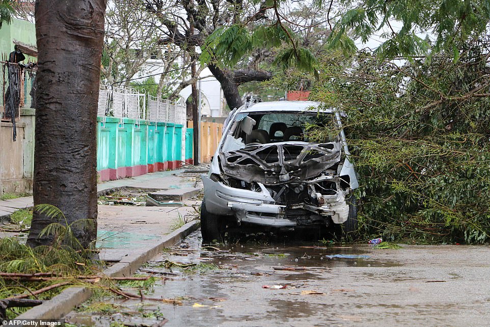 11142926-6822597-a_destroyed_car_is_seen_amid_the_wreckage_caused_by_the_passage_-a-10_1552931810491 A destroyed car is seen amid the wreckage caused by the passage of the cyclone Idai