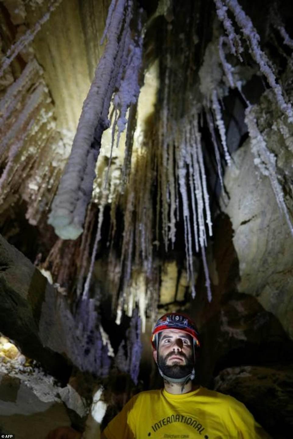 11554580-6858793-israeli_cave_explorer_boaz_langford_stands_in_front_of_salt_stal-a-3_1553779290921 Israeli cave explorer Boaz Langford stands in front of salt stalactites in the Malham cave inside Mount Sodom. Pale salt stalactites hang from the ceilings, and some of the walls sparkle with salt crystals. Drops of salty water are visible at the tips of some of the stalactites