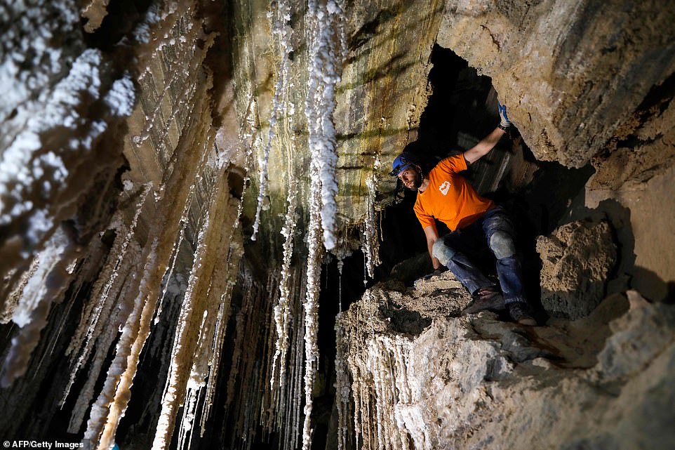 11569442-6858793-image-a-16_1553779505764 Efraim Cohen of the Israel Cave Explorers Club, and of the Malham Cave Mapping Expedition, shows off the salt stalactites inside Mount Sodom, located at the southern part of the Dead Sea in Israel