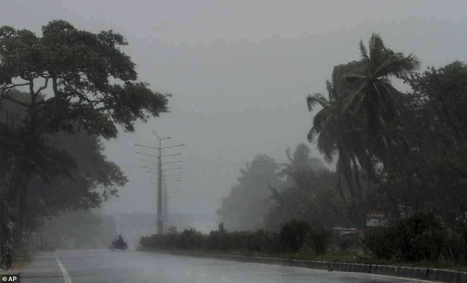 13038570-6988125-desolate_a_motorcyclist_braves_gusty_winds_just_before_the_landf-a-30_1556880886102 Desolate: A motorcyclist braves gusty winds just before the landfall of cyclone Fani, which could reach 125mph winds, on the outskirts of Puri
