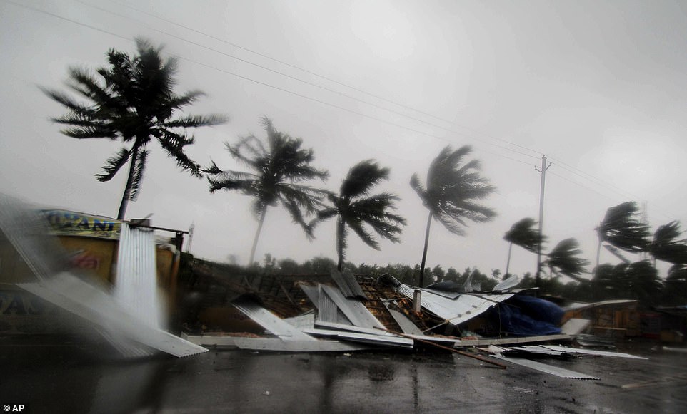13038572-6988125-devastation_street_shops_are_seen_collapsed_while_trees_are_blow-a-31_1556880886103 Devastation: Street shops are seen collapsed while trees are blown ferociously in the winds of Cyclone Fani