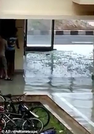 13040220-6988125-image-m-26_1556869883625 This image shows shattered glass on the ground in Bhubaneswar