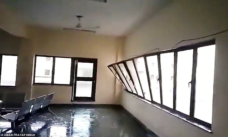 13042390-6988125-bent_out_of_shape_a_glass_window_is_blown_out_of_its_frame_at_a_-a-29_1556880886101 Bent out of shape: A glass window is blown out of its frame at a building in Bhubaneswar as Cyclone Fani makes landfall on Friday