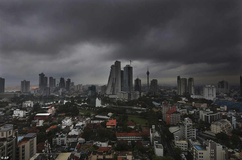 13077794-6991719-image-a-25_1556954595165 Dark clouds from a thunderstorm pass over Colombo, Sri Lanka, Tuesday, April 30, 2019, as warnings for the 'extremely severe' cyclone were issued in India