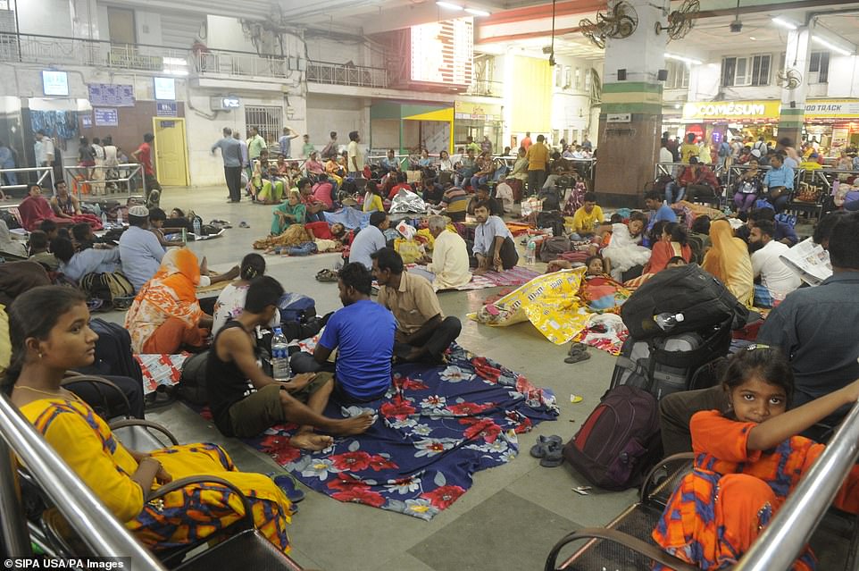 13077958-6991719-image-a-29_1556954684185 Passengers are stranded as trains are cancelled due to the onset of cyclone Fani, at Howrah Railway Station on May 3, 2019 in Kolkata, India. Cyclone Fani tore through India's eastern coast on Friday as a grade 5 storm, lashing beaches with rain and winds gusting up to 205 kilometers per hour and affecting weather as far away as Mount Everest as it approached the West Bengal capital Kolkata