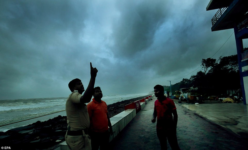13078052-6991719-image-a-68_1556954913742 Disaster Managment Group officials on the deserted banks of the Bay Of Bengal as tourists being evacuted before Cyclone Fani made landfall at neighbouring West Midnapore of West Bengal some 200 km west of Kolkata, eastern India, on Friday