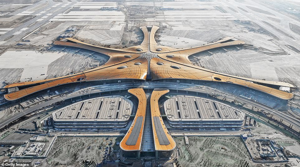 13335408-7011437-image-a-25_1557484147934 With an expected passenger volume of 100 million a year in the long run, Beijing Daxing International Airport will be one of the world's busiest airport. The airport's six-wing terminal building is designed by late British-Iraqi architect Zaha Hadid