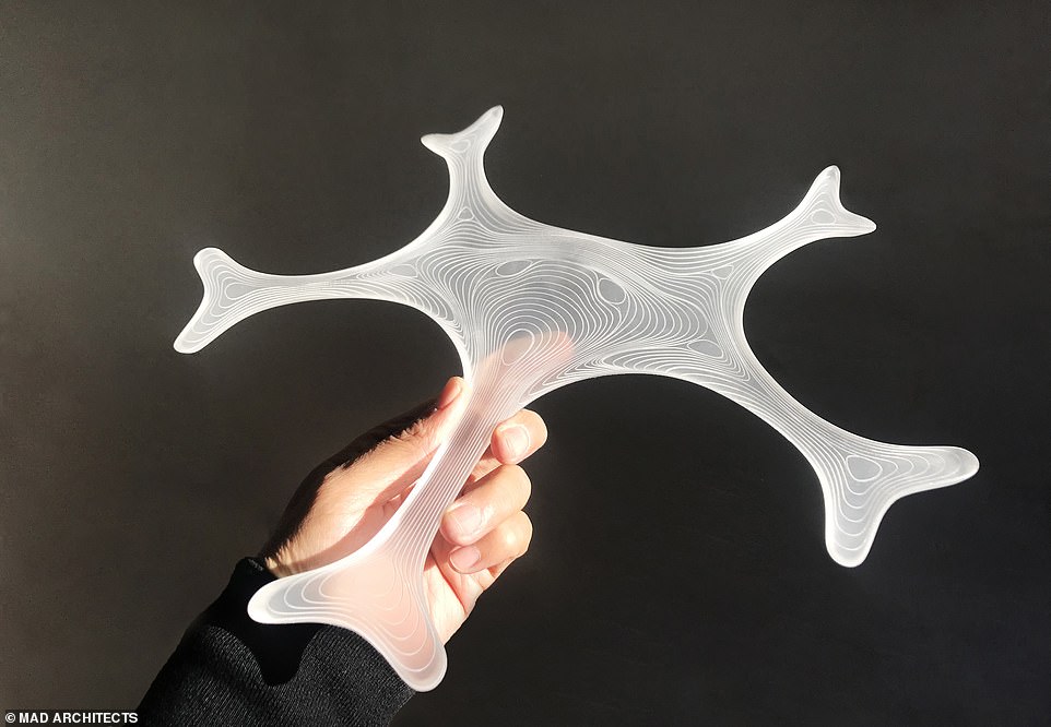 13910434-7067055-image-a-27_1558710886223 Apart from an obvious wintry theme, architects from MAD also hoped the airport building to look like a futuristic spacecraft