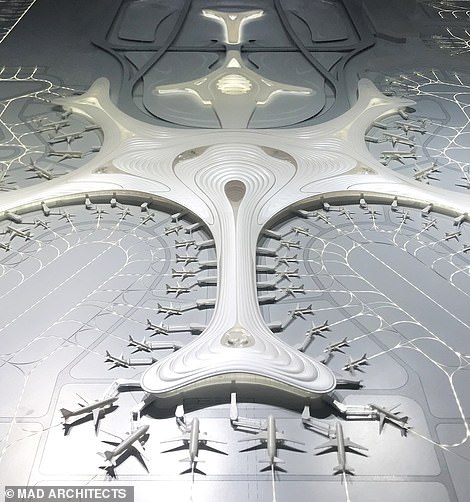 13910436-7067055-image-a-49_1558712176451 The terminal will have 89 aircraft stands and its 'snowflake' design will cut the time passengers spend walking to their gates