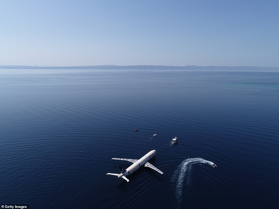 14790610-0-image-a-45_1560520221764 The plane was pushed out to sea and towed a mile into the Gulf of Saros ready to be sunk to a depth of 30 metres (98 feet)