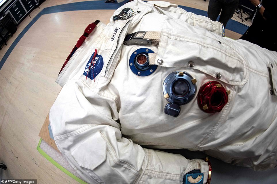 15399216-7191309-image-a-101_1561767853128 The spacesuit of Lunar Mission Apollo 11 Command Module Pilot Michael Collins, who stayed in orbit around the moon while Armstrong and Aldrin left the lunar module. The piece is on display as part of commemorations of half a century-on from the moon-landing