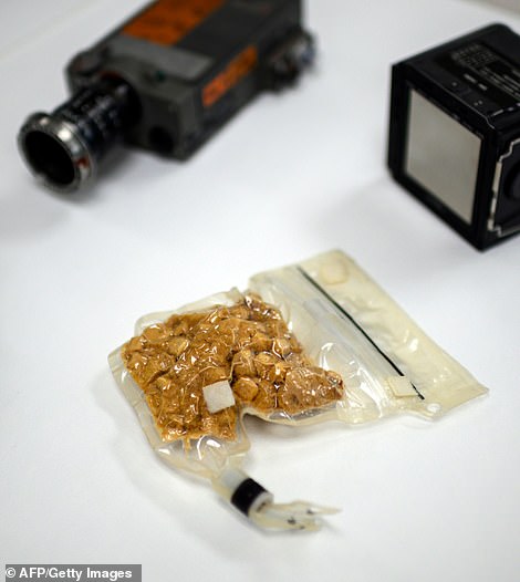 15399224-7191309-image-m-116_1561768101747 A bag of food for Apollo astronauts, pork with potato scallops, is seen inside the Conservation Laboratory
