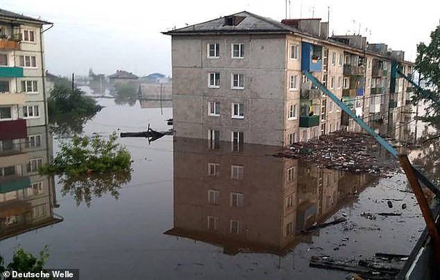 15440598-7197469-in_some_places_water_levels_rose_nearly_halfway_up_apartment_blo-a-16_1561908577031 In some places water levels rose nearly halfway up apartment blocks. More than 4,000 blocks of flats and private homes were so badly flooded that they will have to be rebuilt