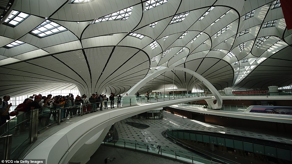 15479672-7200627-image-a-188_1561986869963 Beijing Daxing International Airport will dwarf all Chinese airports in terms of its capacity. According to Xinhua, it is due to process 72 million passengers, two million tonnes of cargo, as well as 620,000 takeoffs and landings a year by 2025