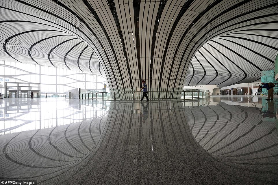 15479720-7200627-image-a-212_1561987248665 China's capital - with its 21 million people - expects to welcome 170 million passengers in 2025, split between the two airports