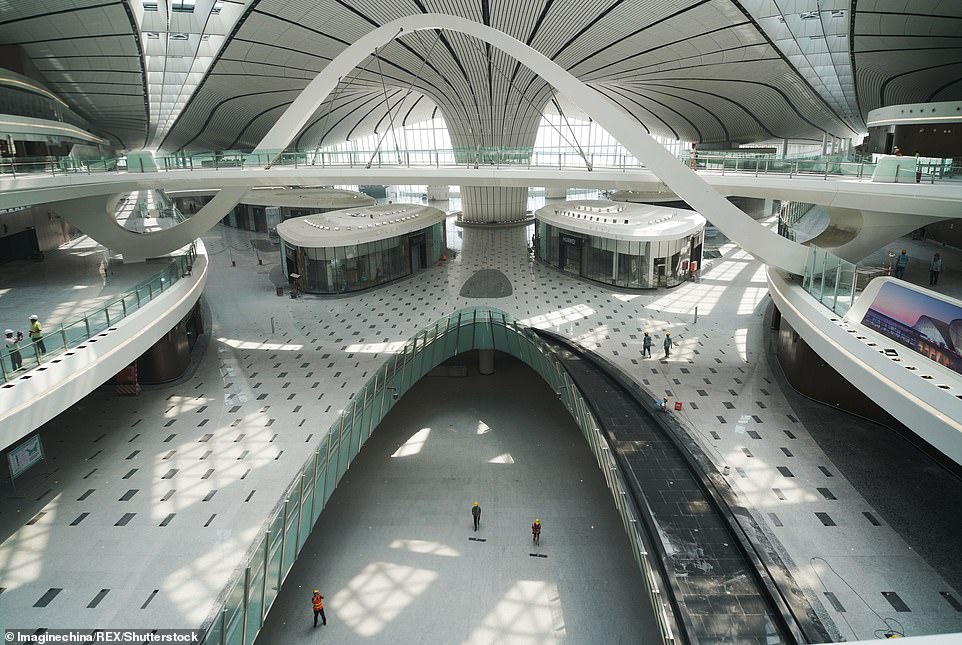 15479782-7200627-image-m-161_1561986730056 By 2040 the hub is expected to have expanded to eight runways including one for military use, and will be able to welcome 100 million passengers per year - which will make it the world's largest single terminal in terms of traveller capacity