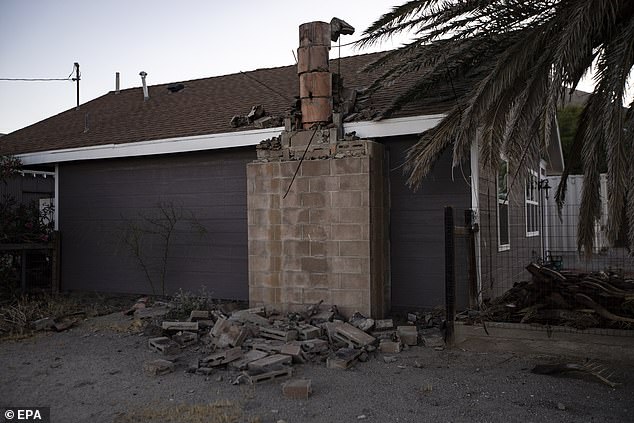 15672804-7216817-image-a-3_1562332305059 Bricks from a house's chimney sit on the ground in the wake of the tremor in Ridgecrest