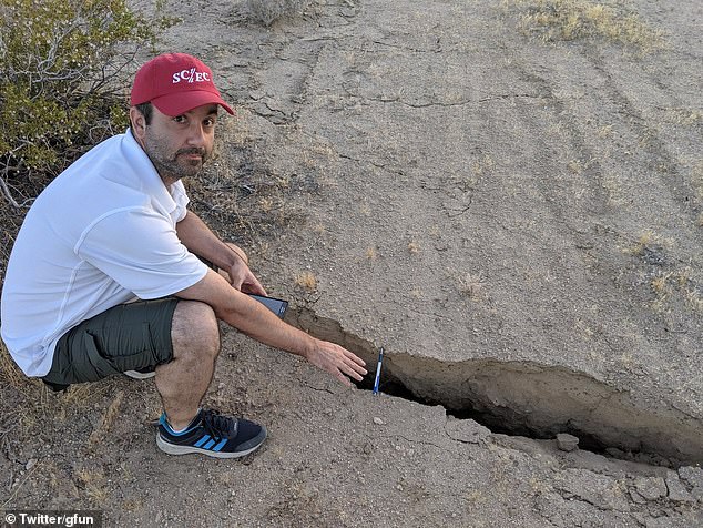 15677806-7216817-image-a-39_1562338948633 The damage prompted Ridgecrest's mayor and Governor Gavin Newsom to declare a state of emergency. Pictured: A man shows how far a road crack caused by the earthquake extends by using a pen