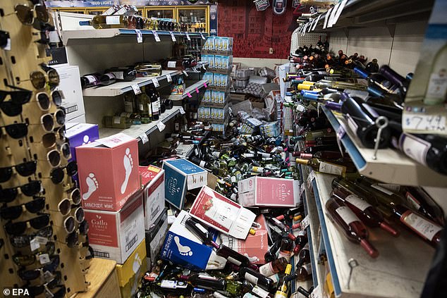 15704702-7219443-image-a-22_1562417043347 A view of fallen bottles that smashed on the ground after an earthquake, at a gas station and liquor store in Ridgecrest, California