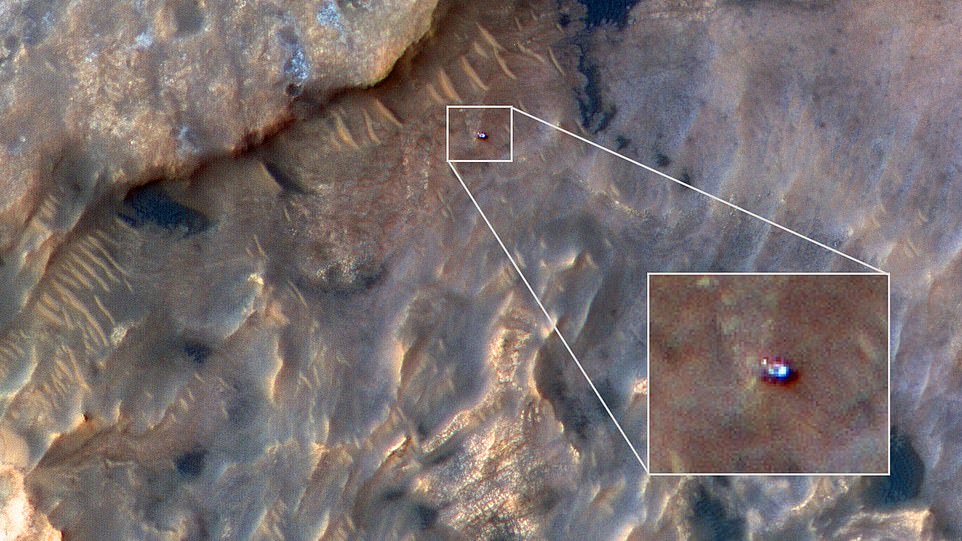 15983102-7242473-image-a-11_1562968918336-2 In the latest image captured by an instrument aboard the space agency’s Mars Reconnaissance Orbiter, Curiosity can be seen as just a small blueish speck in an area known as the Woodland Bay. MRO’s High Resolution Imaging Science Experiment (HiRISE) camera caught this view on May 31