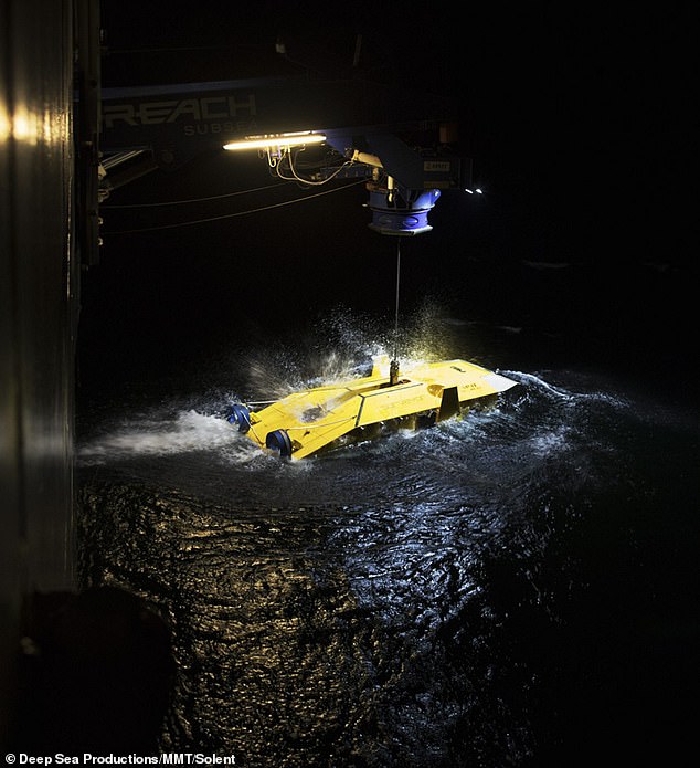 16350292-7273037-image-m-111_1563807284953 Delicate operation: The Surveyor Interceptor is seen being deployed in order to retrieve the wreckage without it disintegrating upon exposure to the elements