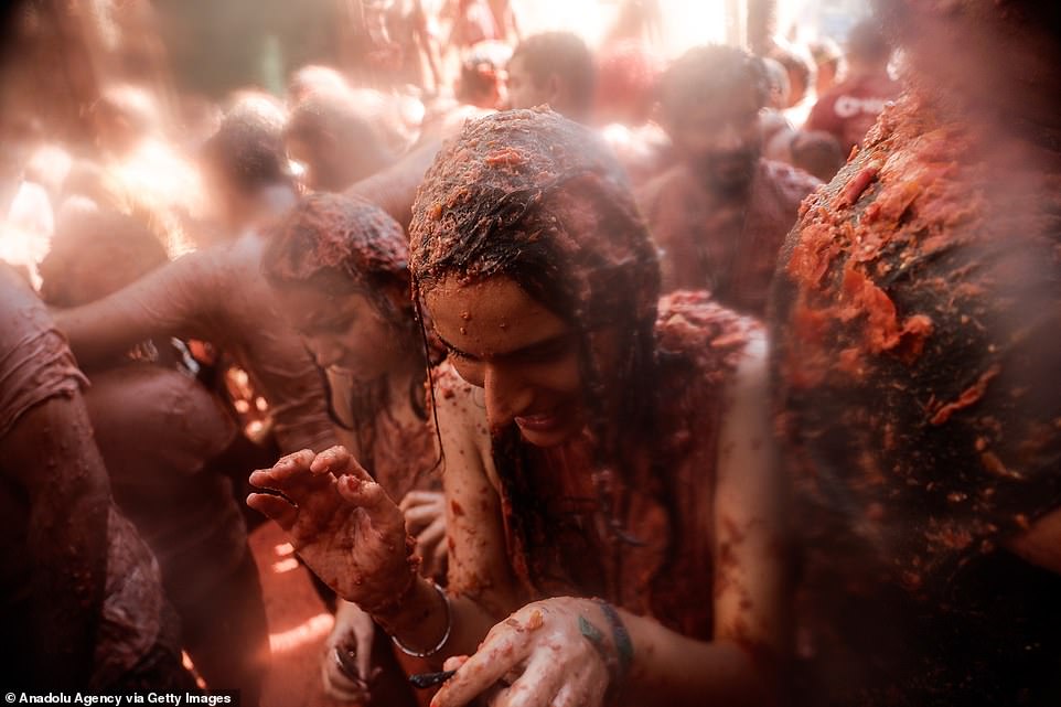 17792422-7403445-image-a-54_1567005441633 Although spirits seemed high among most of the revellers, some seemed a bit shocked by just how much tomato pulp covered their entire bodies